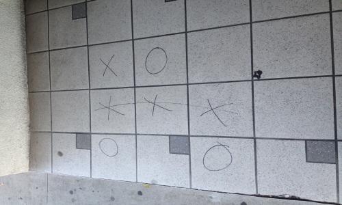 Picture of X's and O's on tile entryway
