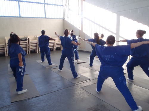 Inmates participate in Yoga