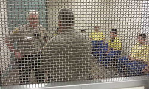 Teenagers in the holding cell