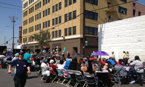 Occupied tables set up in front of the Fred Jones Mission