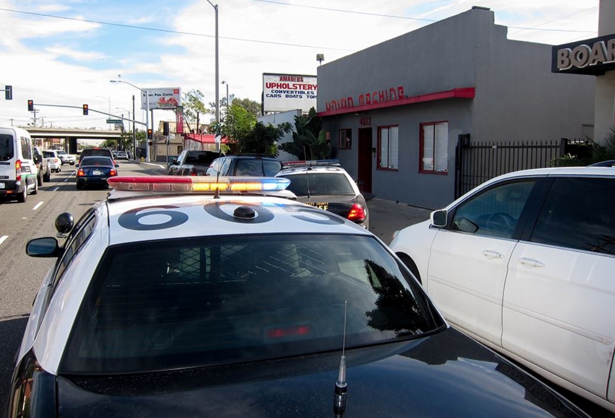 Police Cars in front of Tattoo Shop