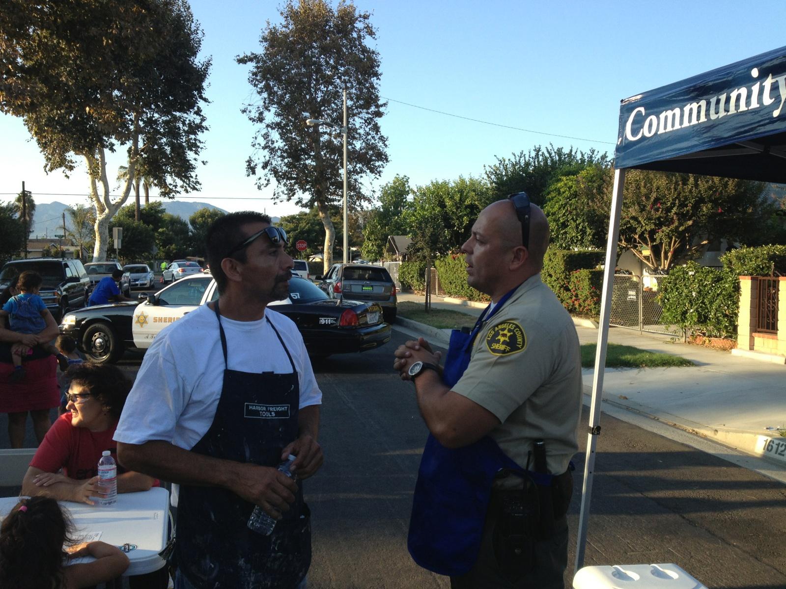South El Monte Special Assignment Deputy Catano speaking with a resident while BBQing for the attendees